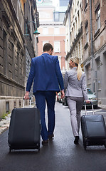 Image showing business people couple entering  hotel