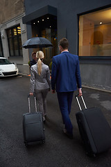 Image showing business people couple entering  hotel