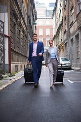 Image showing business people couple entering  hotel