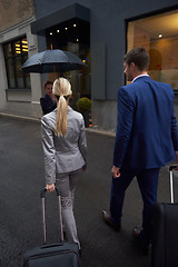 Image showing business people couple entering  hotel