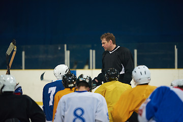 Image showing ice hockey players team meeting with trainer