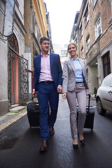 Image showing business people couple entering  hotel