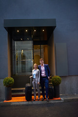 Image showing business people couple entering  hotel