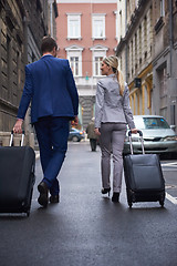 Image showing business people couple entering  hotel