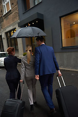 Image showing business people couple entering  hotel