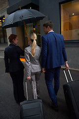 Image showing business people couple entering  hotel