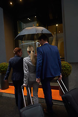 Image showing business people couple entering  hotel