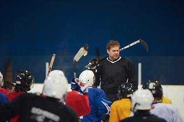 Image showing ice hockey players team meeting with trainer