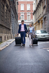 Image showing business people couple entering  hotel