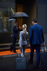 Image showing business people couple entering  hotel