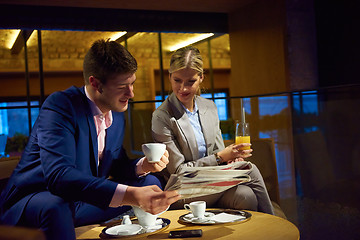 Image showing business couple take drink after work