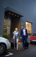 Image showing business people couple entering  hotel