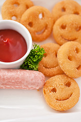 Image showing sausages with smiling potatoes