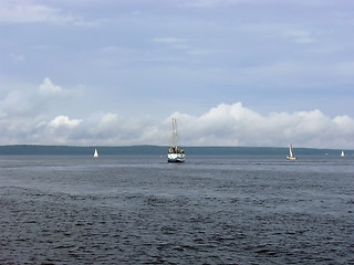 Image showing Clouds and yachts