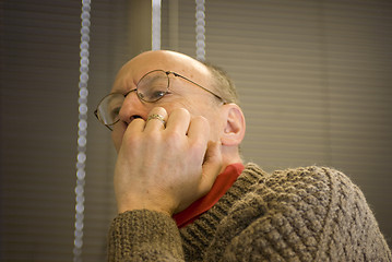 Image showing senior man concentrating