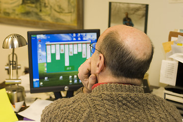 Image showing man looking at computer screen in office