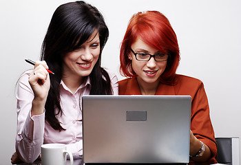 Image showing two beautiful women are working