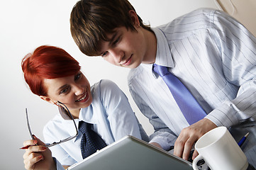 Image showing beautiful caucasian business woman with young consultant