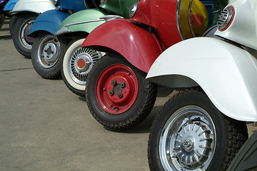 Image showing Front wheels of scooters