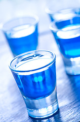 Image showing blue alcoholic drink into small glasses