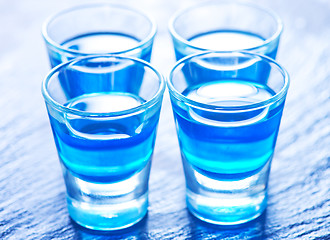 Image showing blue alcoholic drink into small glasses