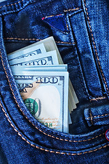 Image showing dollars in jeans pocket