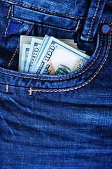 Image showing dollars in jeans pocket