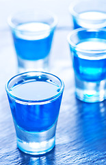 Image showing blue alcoholic drink into small glasses