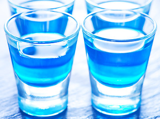 Image showing blue alcoholic drink into small glasses