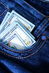 Image showing dollars in jeans pocket