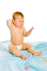 Image showing upset baby in diapers. Studio