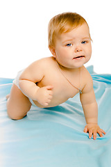 Image showing upset baby in diapers. Studio