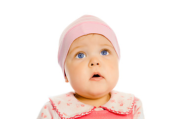 Image showing baby girl in a pink dress and hat. Portrait. Studio. Isolated.
