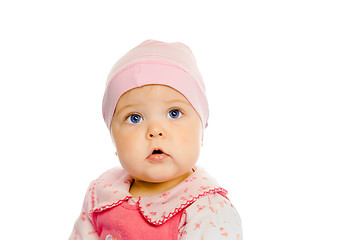 Image showing baby girl in a pink dress and hat. Portrait. Studio. Isolated.