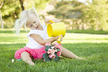 Image showing Little Girl Playing Gardener with Her Tools and Flower Pot