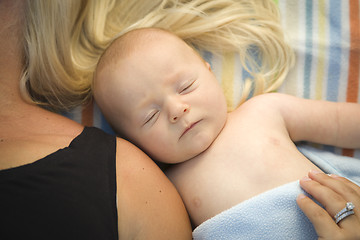 Image showing Cute Baby Boy Laying Next to His Mommy on Blanket