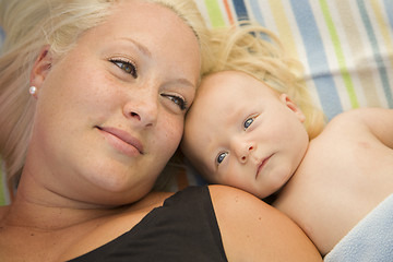 Image showing Cute Baby Boy Laying Next to His Mommy on Blanket
