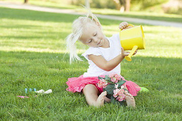 Image showing Little Girl Playing Gardener with Her Tools and Flower Pot