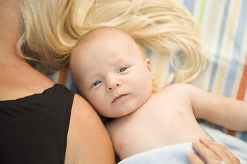 Image showing Cute Baby Boy Laying Next to His Mommy on Blanket