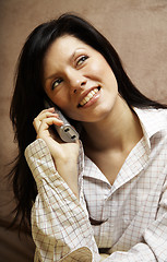 Image showing young woman is speaking on cell phone