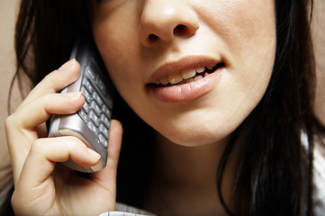 Image showing young woman is speaking on cell phone