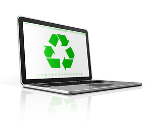 Image showing Laptop computer with a recycling symbol on screen. environmental