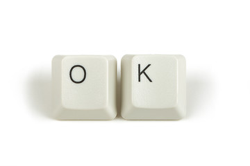 Image showing ok from scattered keyboard keys on white