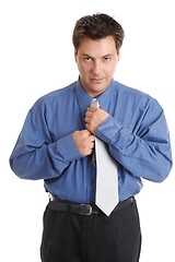 Image showing Businessman getting dressed