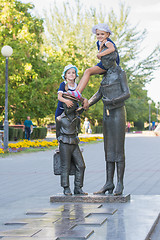 Image showing Two girls on the monument to the first teacher