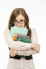 Image showing Strict teacher with books and notebooks