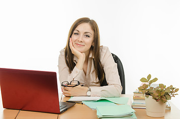 Image showing Portrait of positive teacher with glasses in their hands