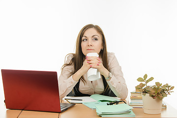 Image showing She thought the teacher holding a notebook in his hands