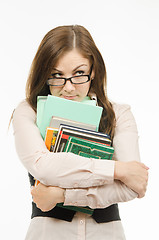 Image showing Dodgy teacher with textbooks and notebooks