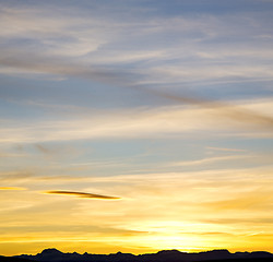 Image showing sunrise in the colored sky white soft clouds and abstract backgr